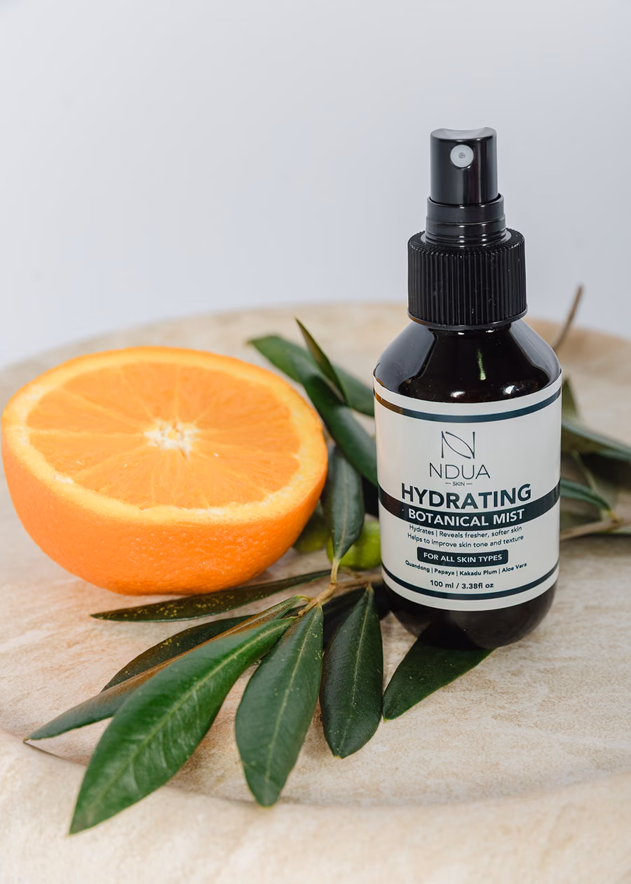 Ndua Skin botanical skincare with orange and native foliage